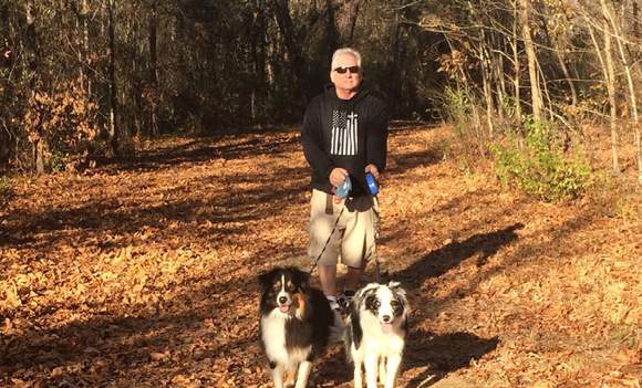 Bob Berg walking his dogs