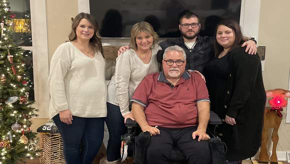 Rick Madeja, pictured with his family, no longer needs to travel for 45 minutes to receive neurological rehab from his spinal injury.