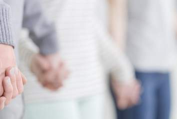 Support Group holding hands